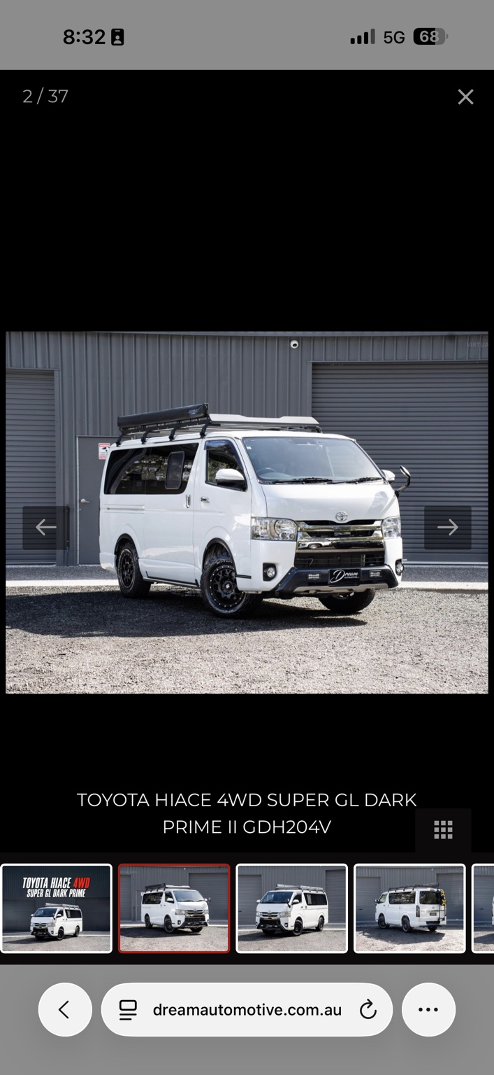 White Toyota Hiace with roof rack and awning
